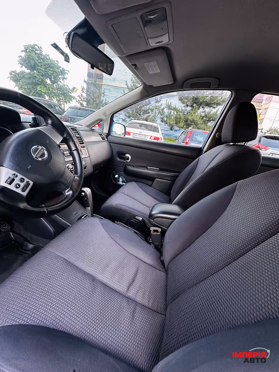 Nissan Tiida - фото 6