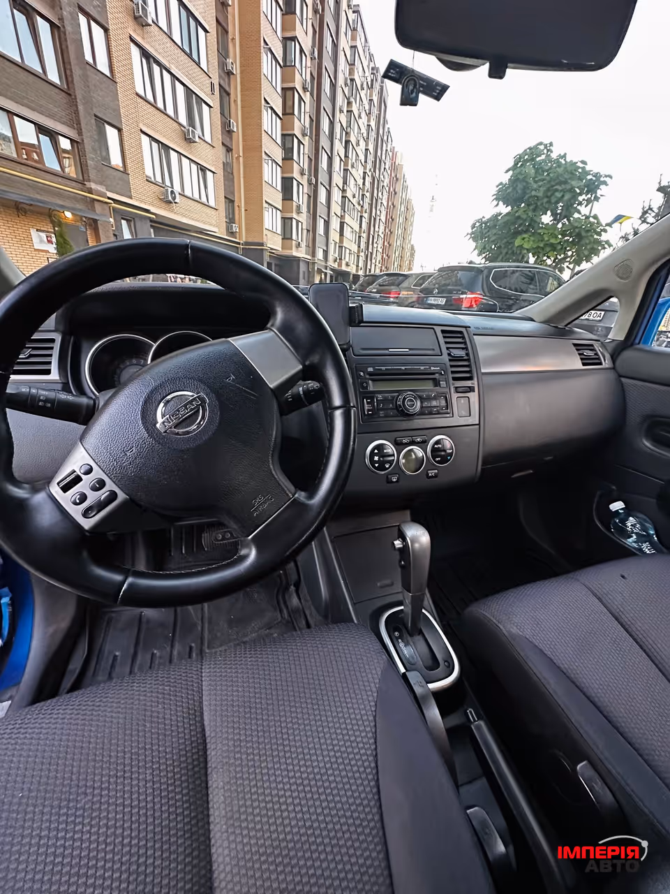 Nissan Tiida - фото 7