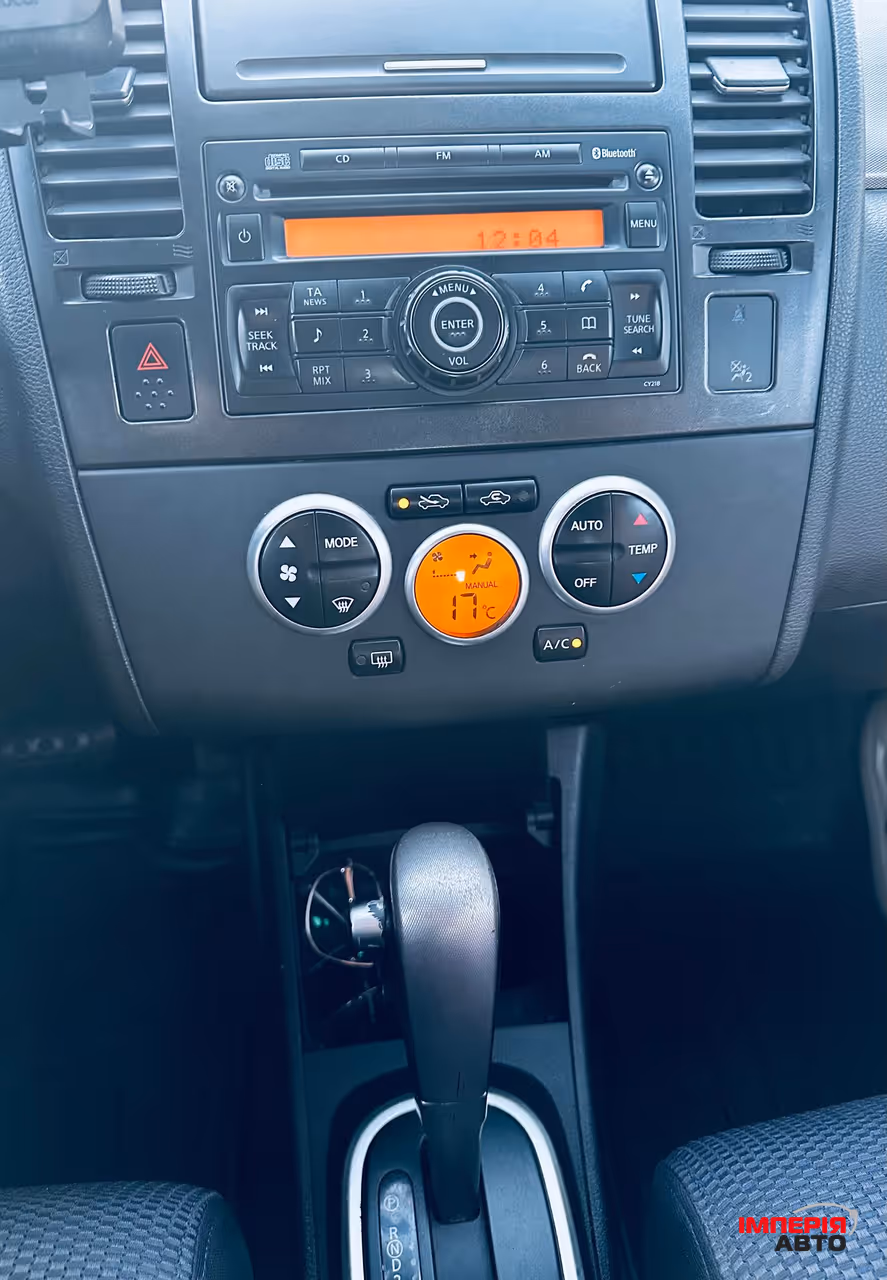 Nissan Tiida - фото 2