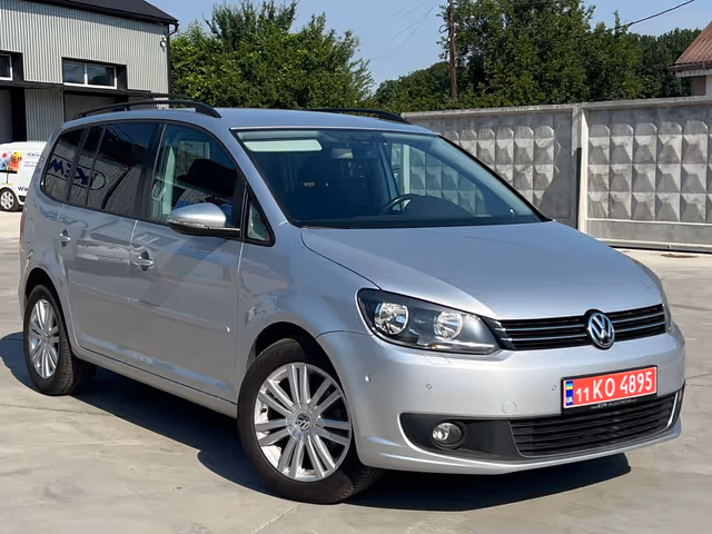 Volkswagen Touran - фото 1