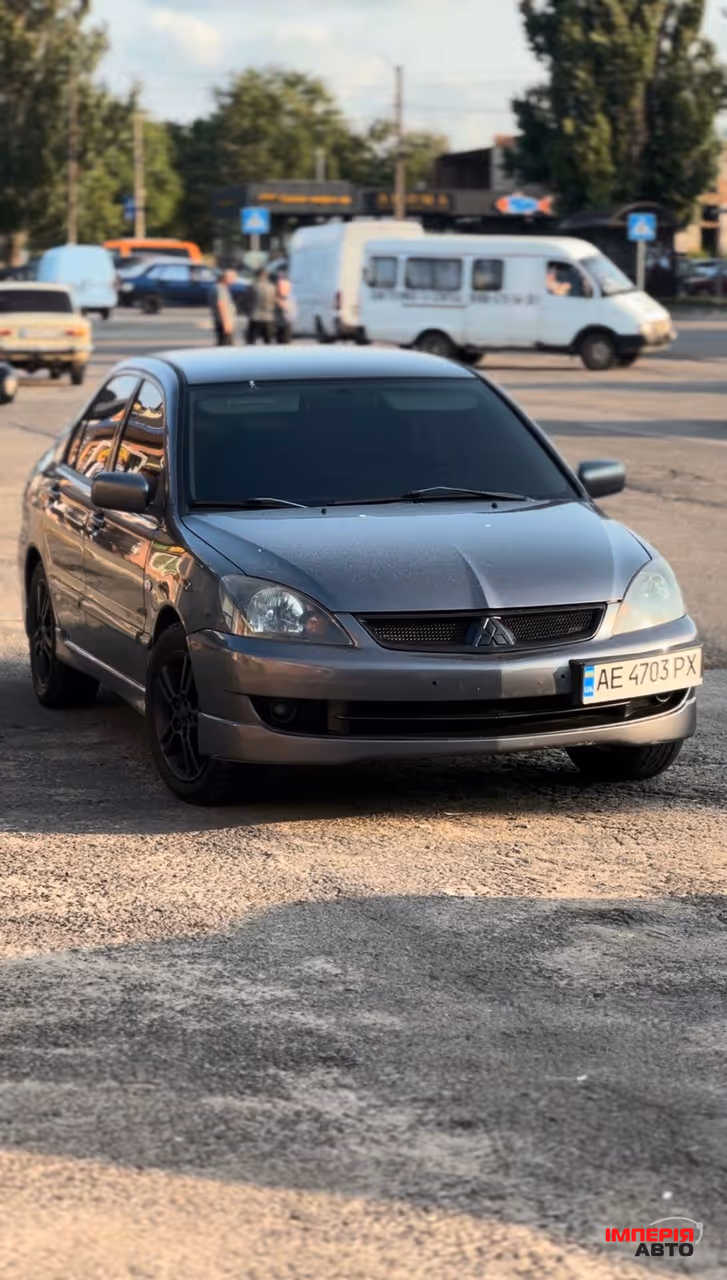 Mitsubishi Lancer - фото 1