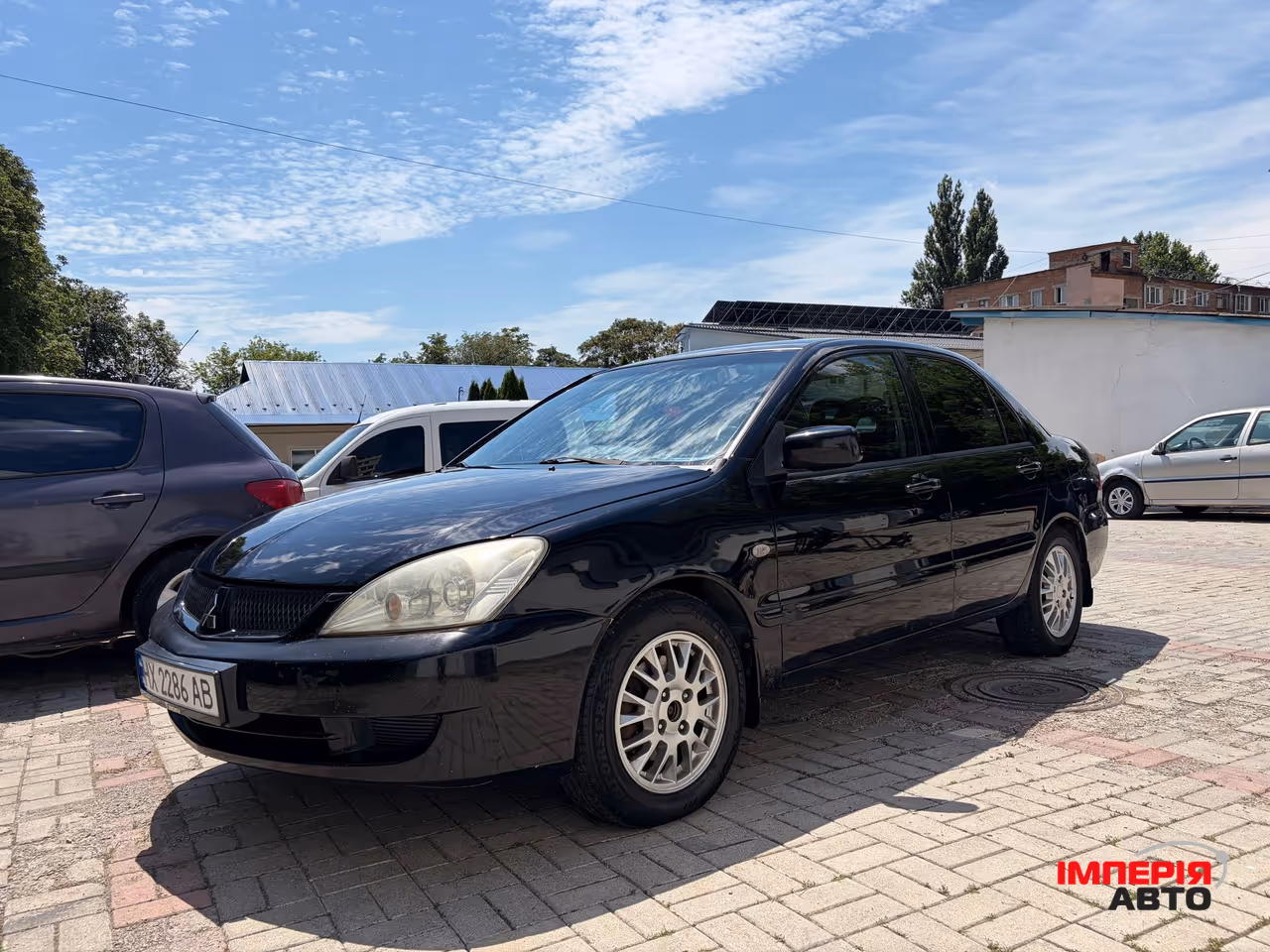 Mitsubishi Lancer - фото 1