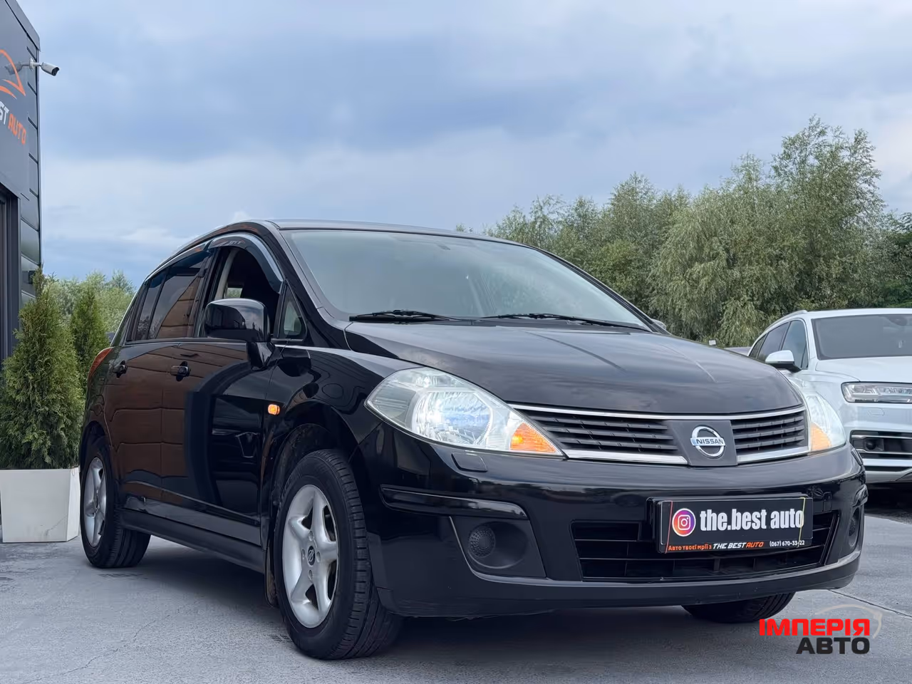 Nissan Tiida - фото 7