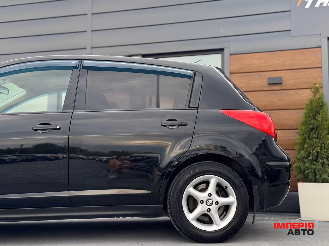 Nissan Tiida - фото 10