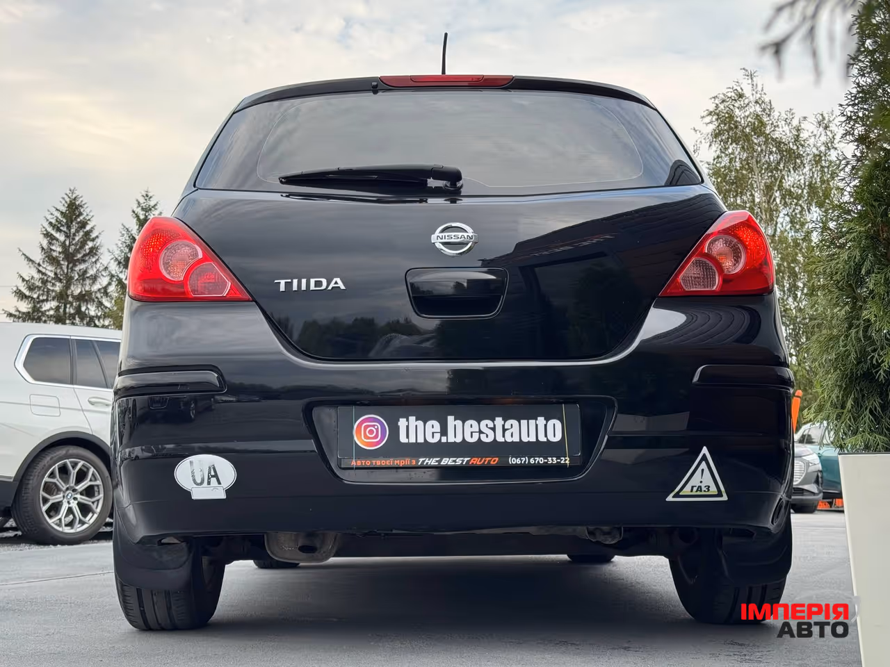 Nissan Tiida - фото 12