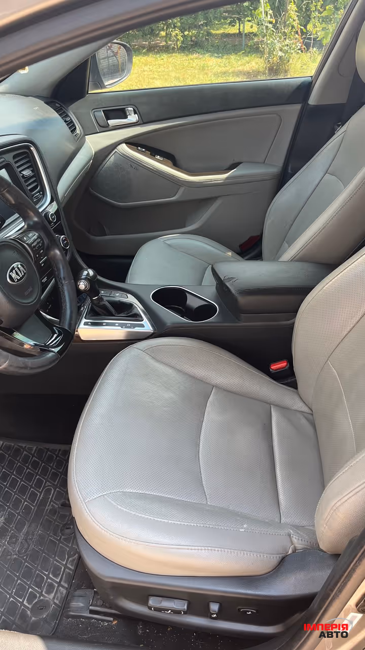 Kia Optima - фото 9