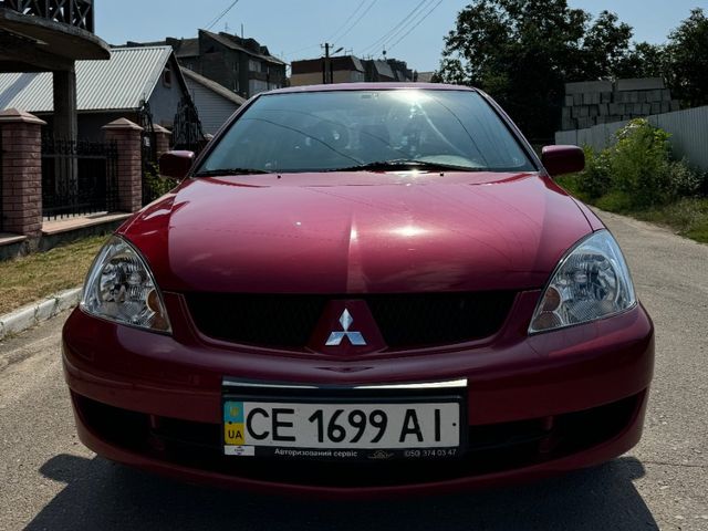 Mitsubishi Lancer - фото 1