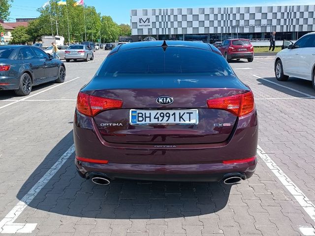Kia Optima - фото 5