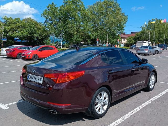 Kia Optima - фото 4