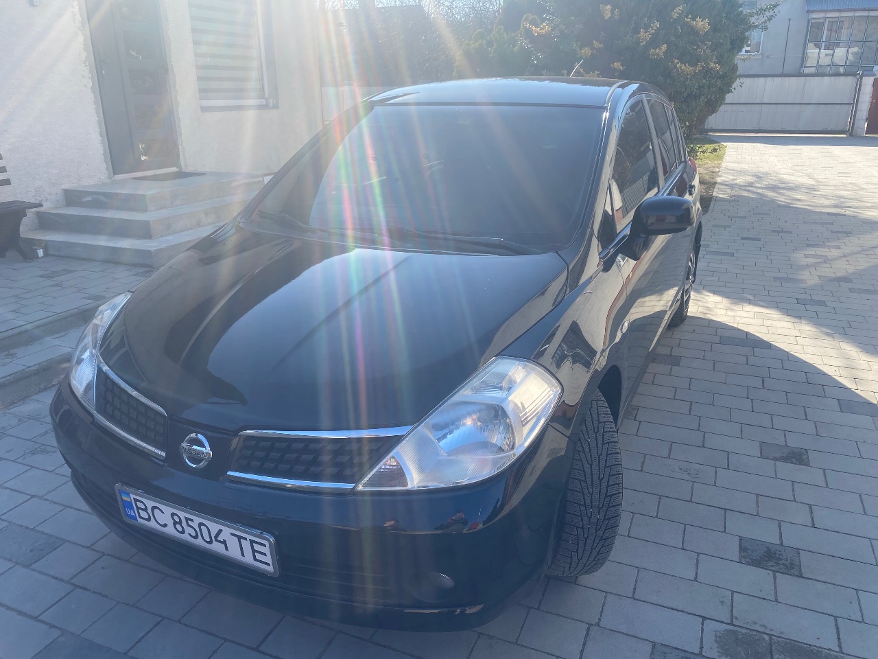 Nissan Tiida - фото 8