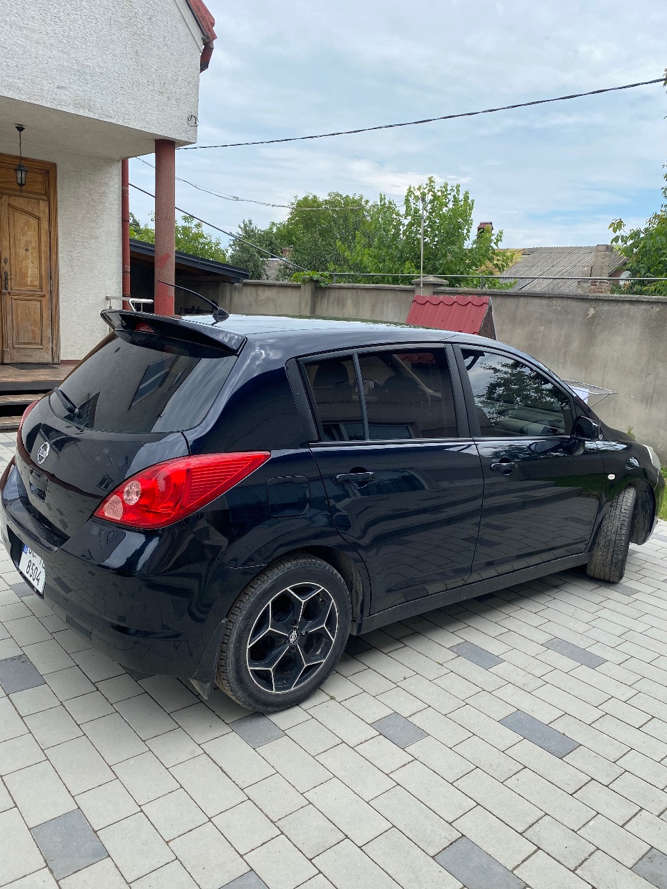 Nissan Tiida - фото 4