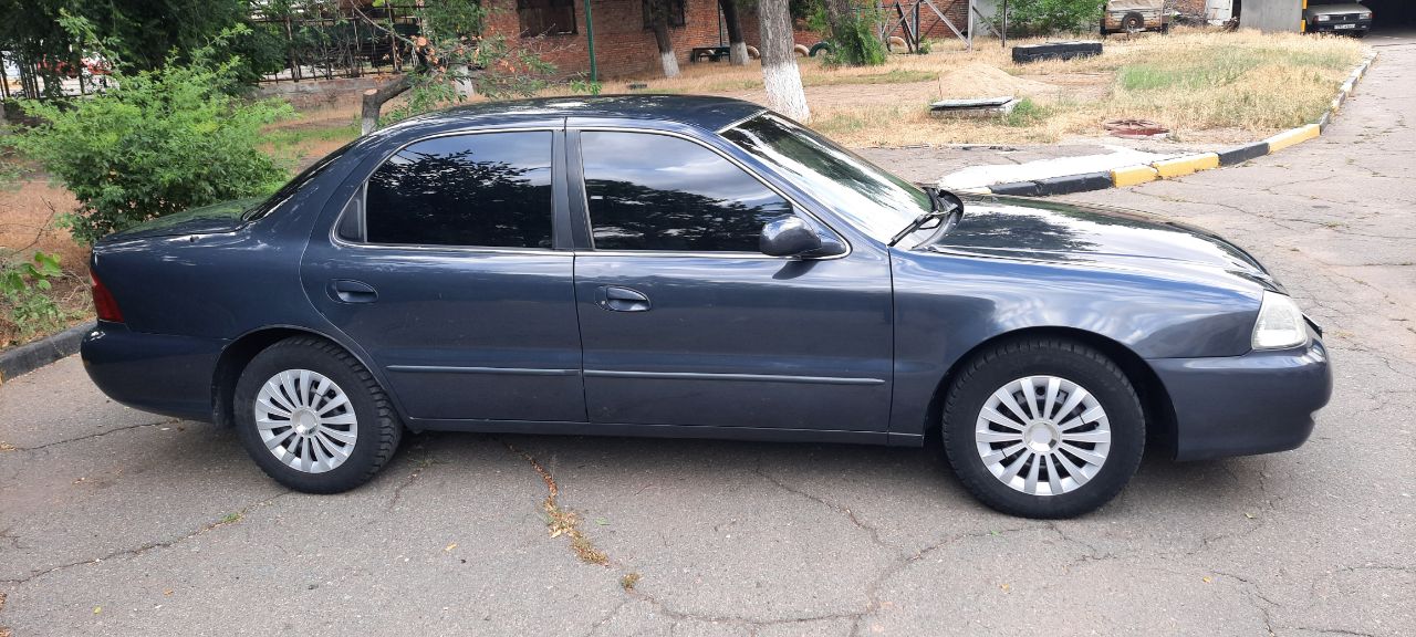 Kia Clarus - фото 12