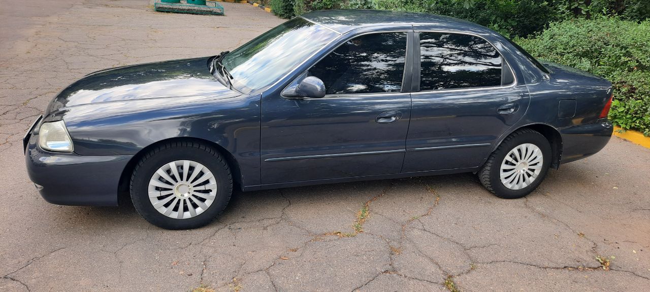 Kia Clarus - фото 11