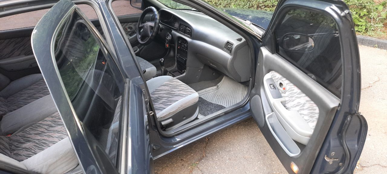 Kia Clarus - фото 7