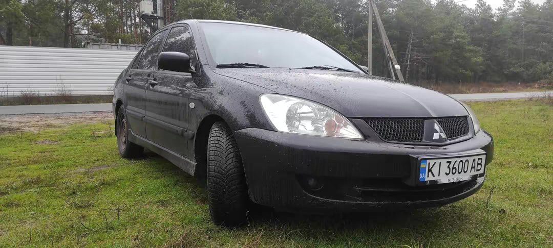 Mitsubishi Lancer - фото 1